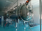 Low temperature vacuum belt dryer for spices, seasoning mixes, condiments and other flavors